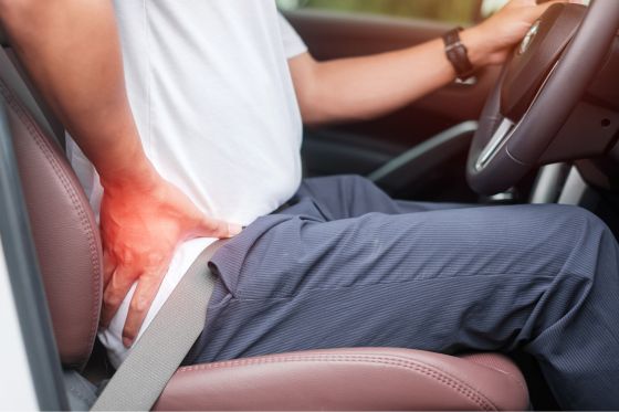 Man Suffering From Back Pain While Driving